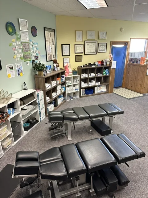 The front desk and adjusting area at Spine and Scoliosis Clinic